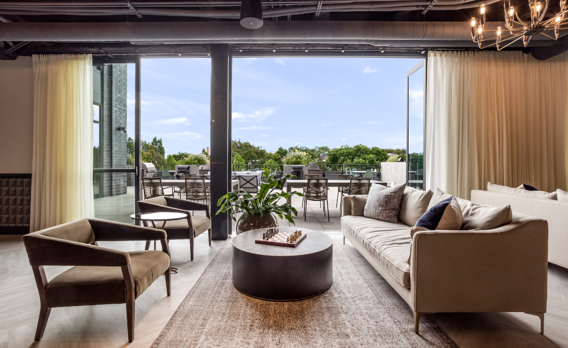 Resident clubroom at Logan Apartments in Logan Square Chicago with upscale lounge seating and modern design