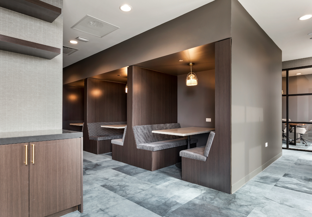 Co-working lounge at Logan Apartments in Logan Square Chicago with comfortable workspace and natural light