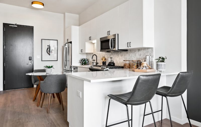 Demonstration kitchen at Logan Apartments in Logan Square Chicago with high-end appliances and finishes