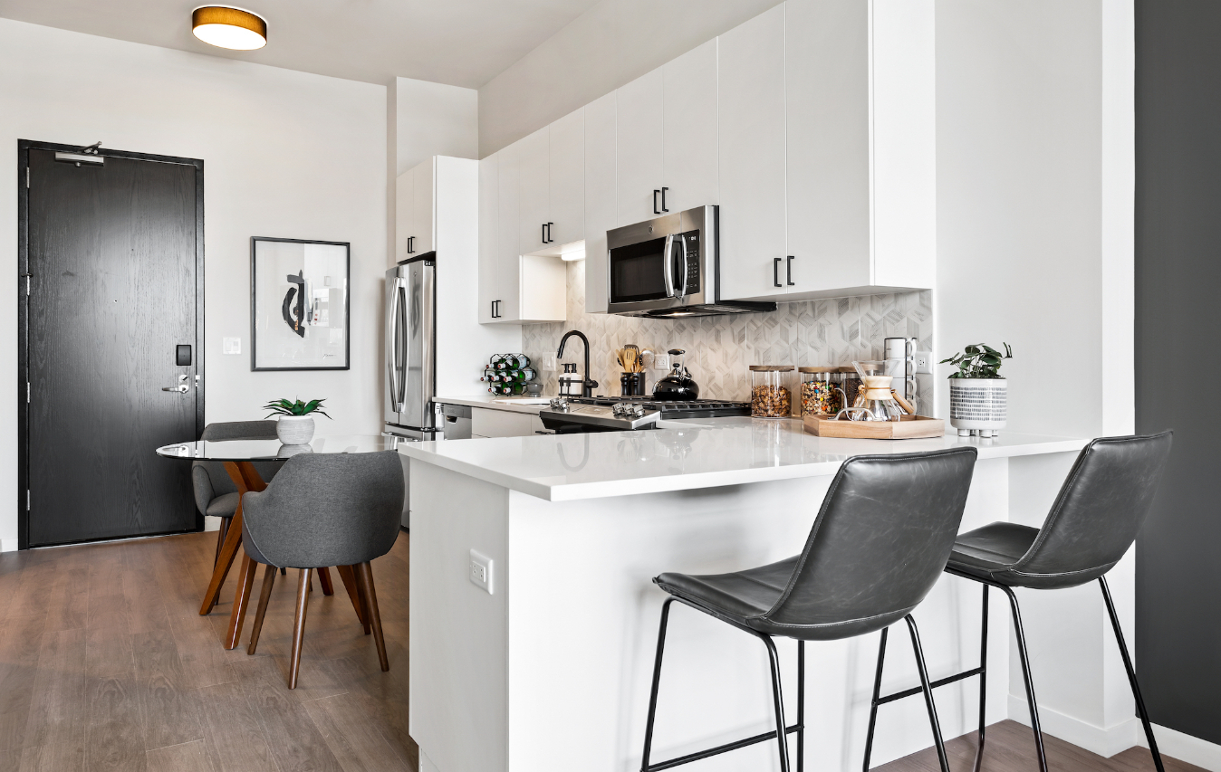 Demonstration kitchen at Logan Apartments in Logan Square Chicago with high-end appliances and finishes