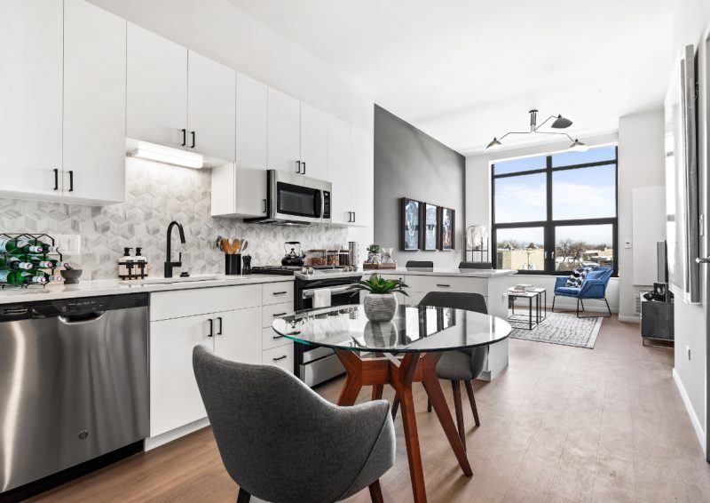 Demonstration kitchen at Logan Apartments in Logan Square Chicago with high-end appliances and finishes